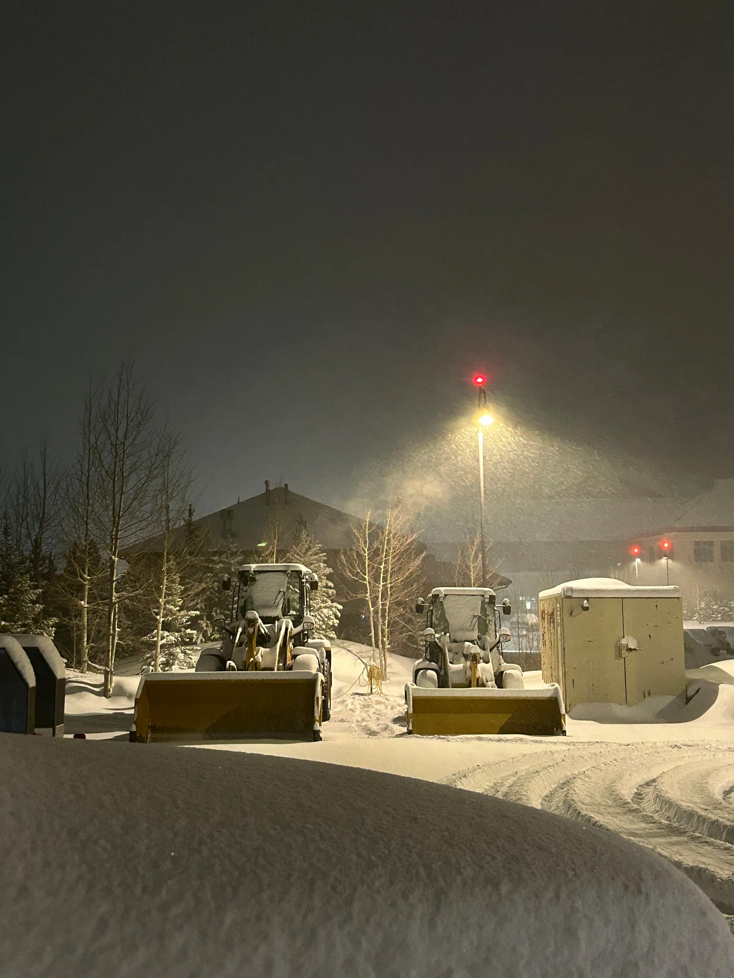 Alpine Snowworks equipment working a site at night