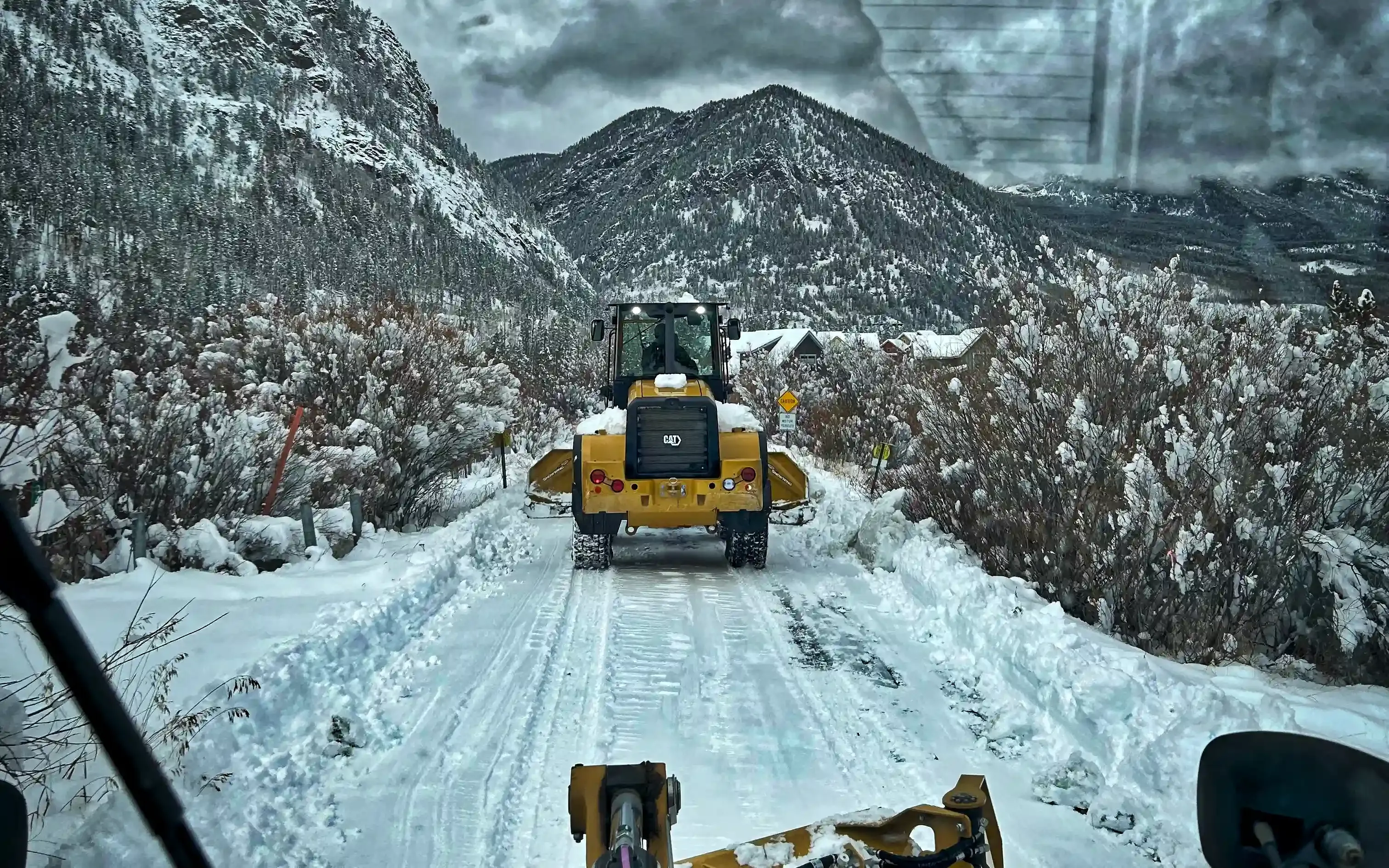 Alpine Snowworks loader clearing a mountain road