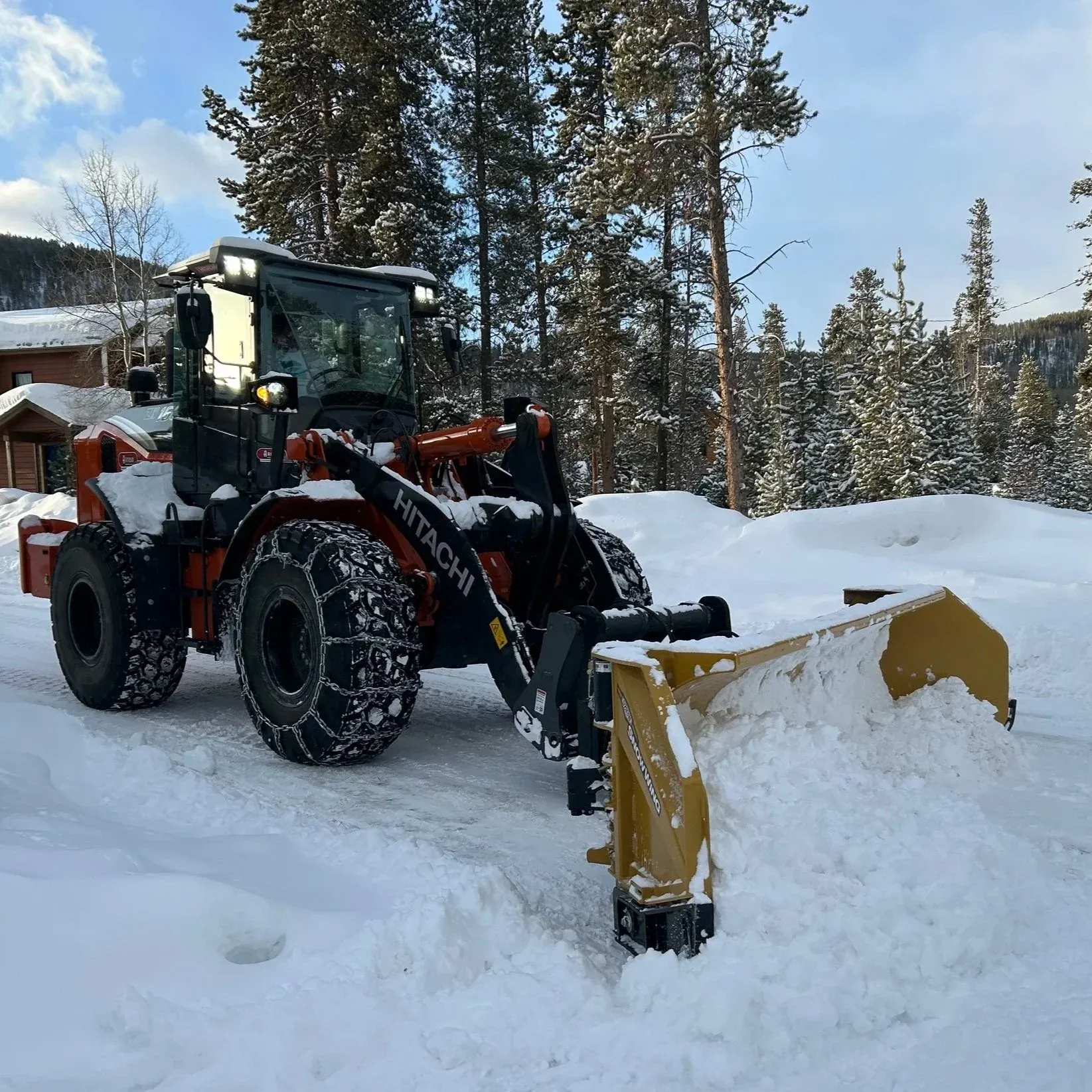 Alpine Snowworks plow clearing a commercial lot